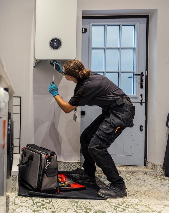 Engineer installing boiler