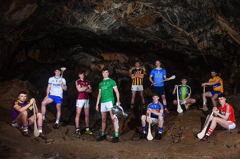 Hurling players standing in a cave