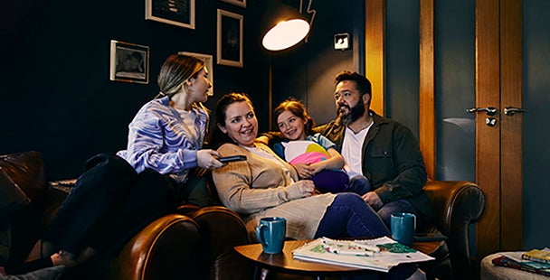 Family sitting on a sofa