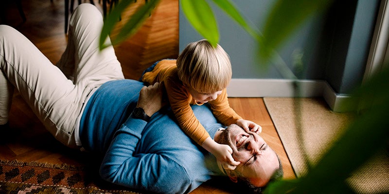 Boy playing with father