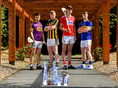 4 hurlers standing with trophies