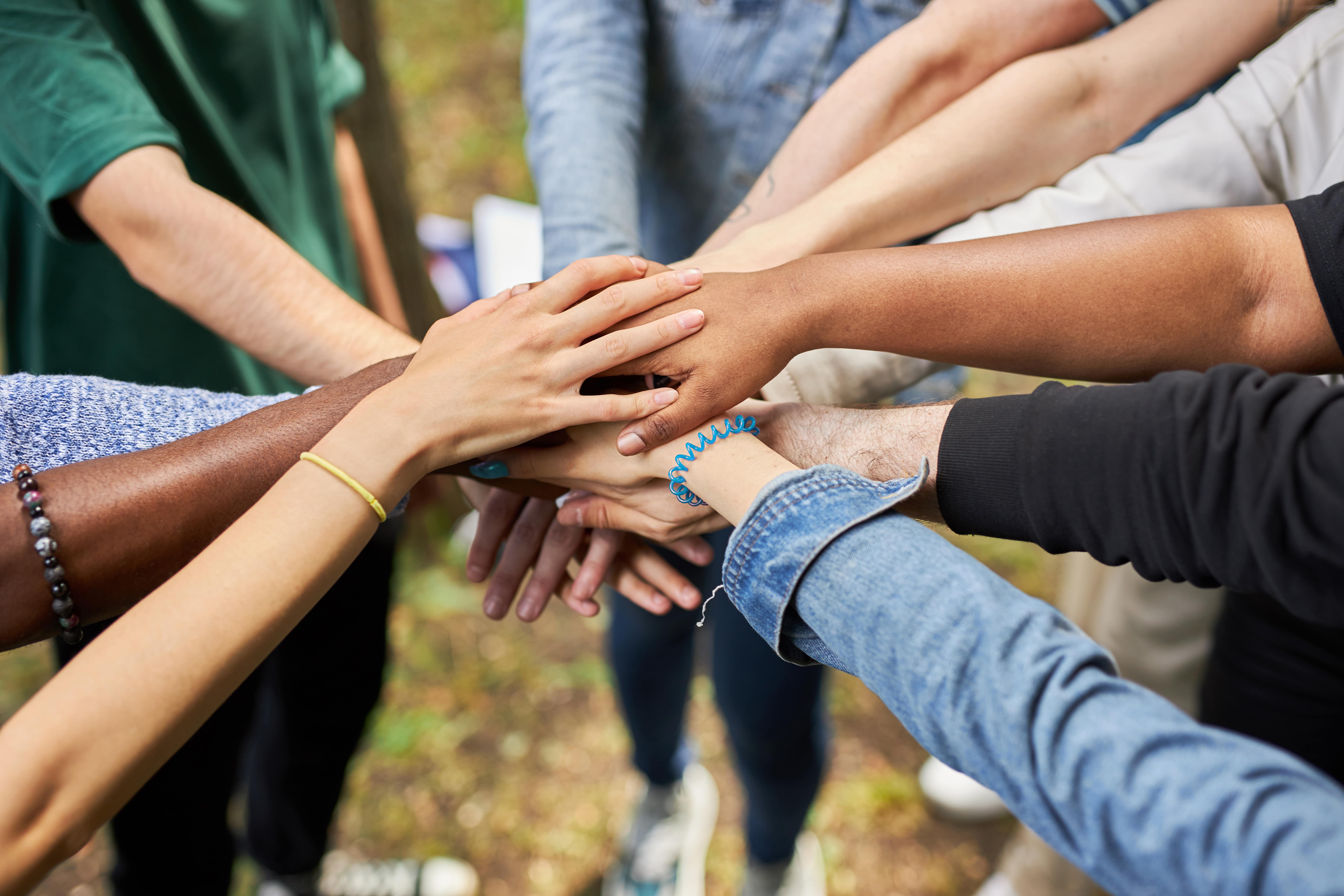 Circle of hands - representing inclusion and diversity