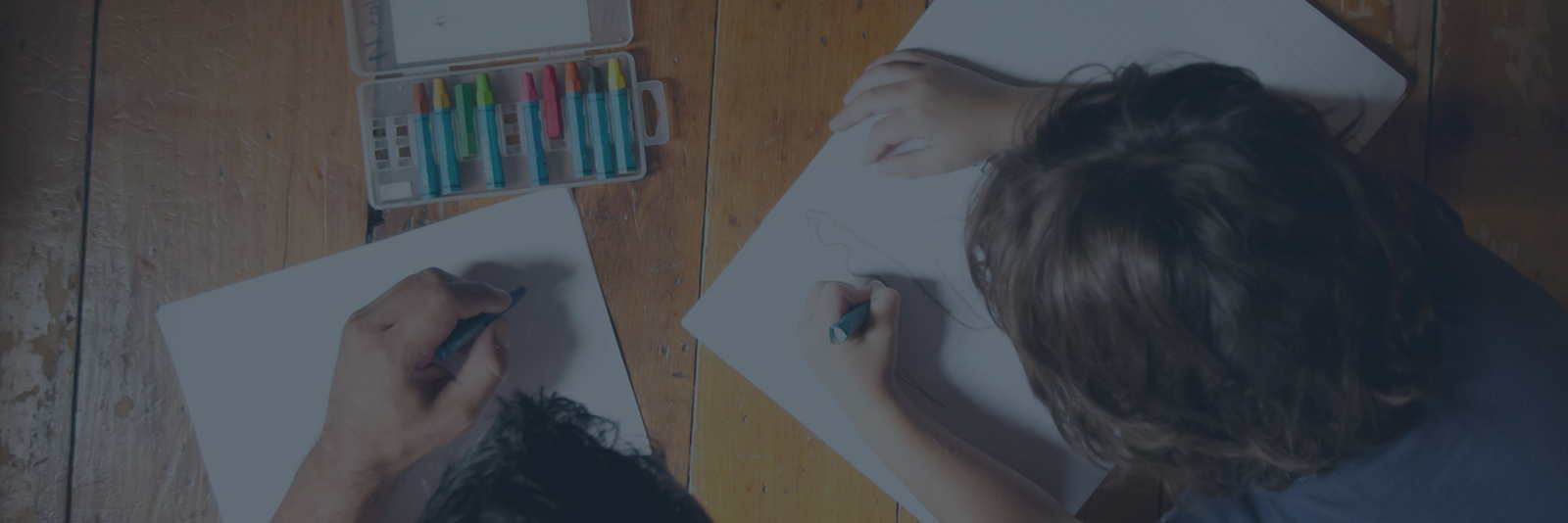 Children drawing on the kitchen table