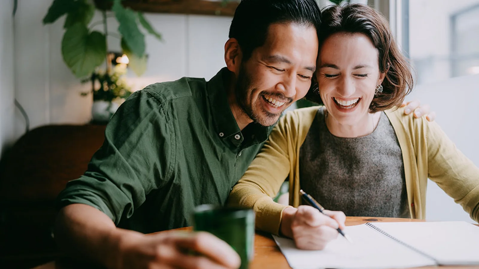 A man and woman laughing together