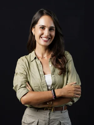 Picture of Martina standing against a black background