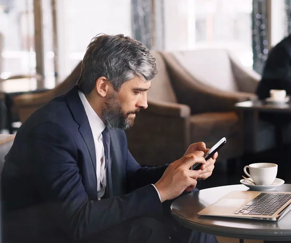 man in a suit looking busy