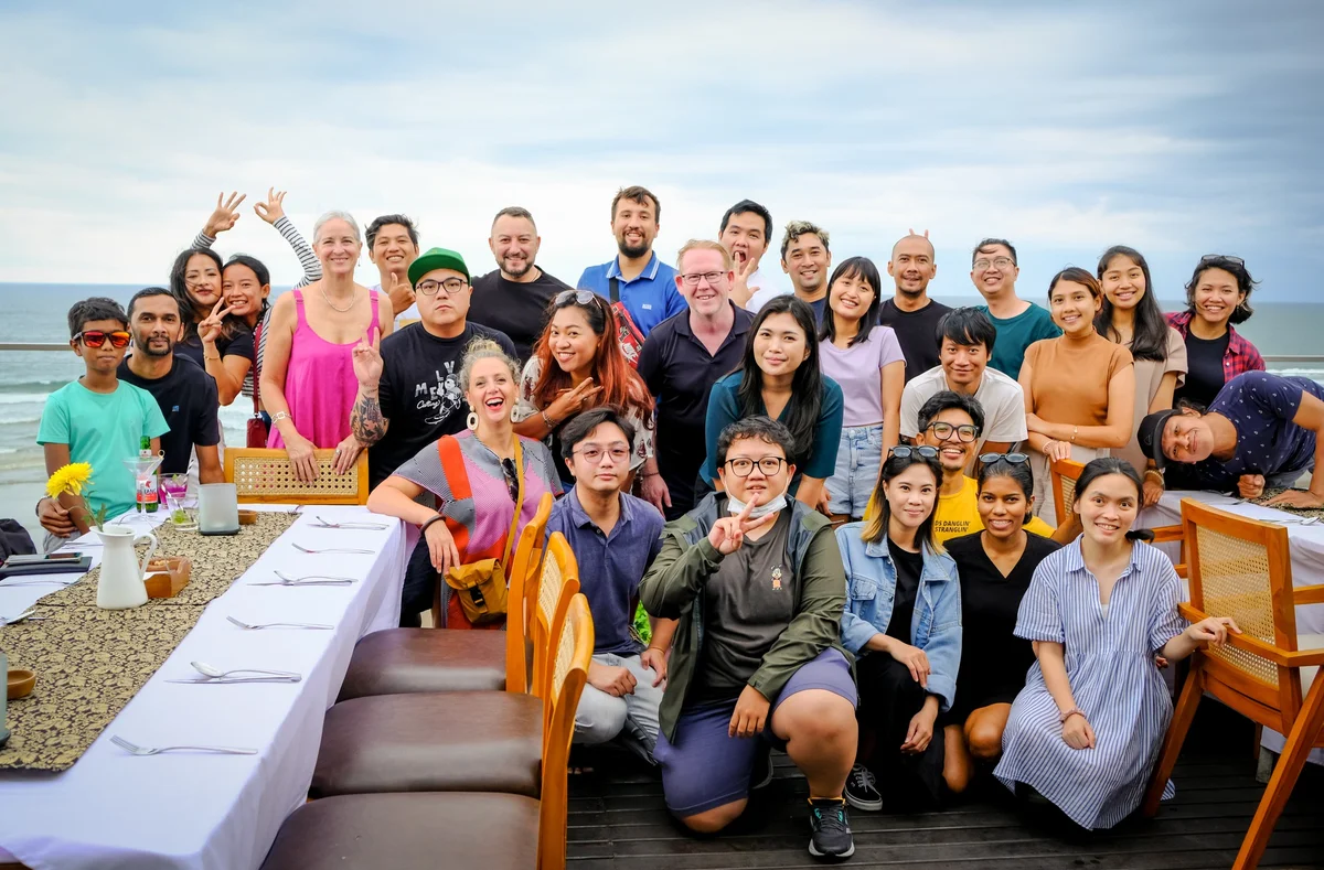 Picture of the Bali team on the beach celebrating