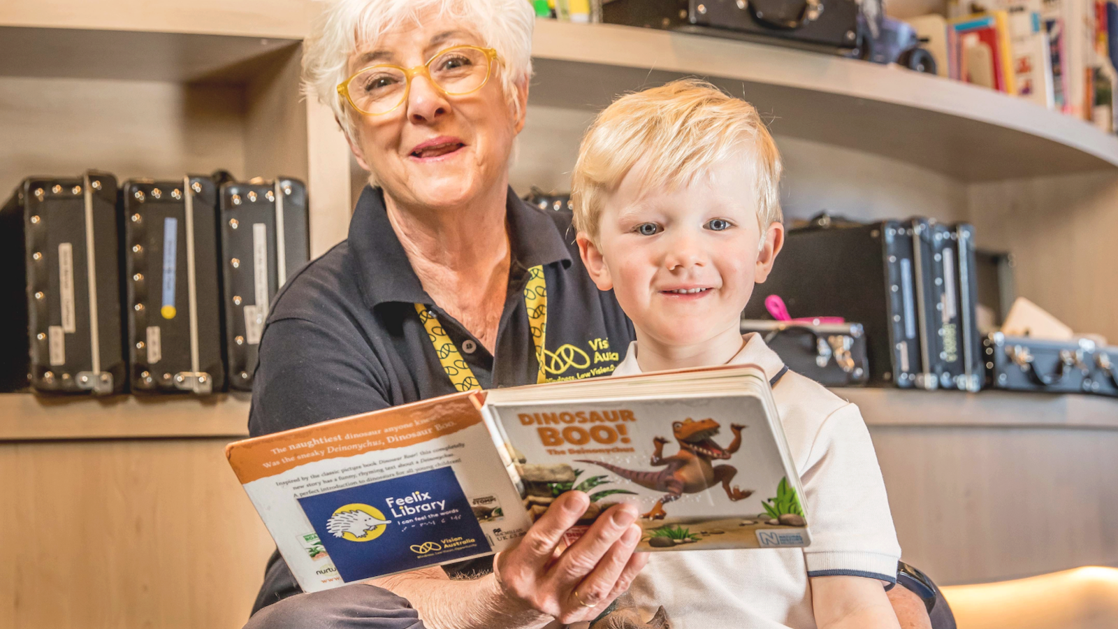 Older woman reading to a small child