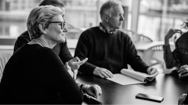 Picture of legalsuper team in a meeting in black and white