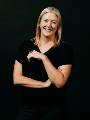 Picture of Charlotte Miller standing up against a black background