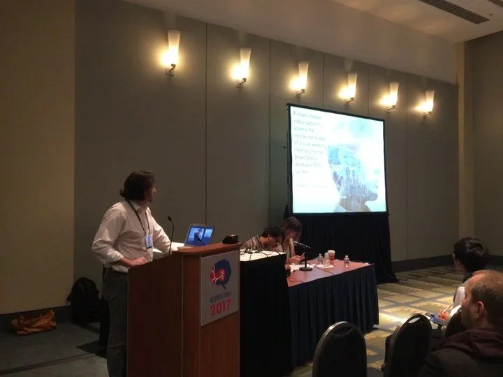 Picture of Kaushal presenting at a conference for Neuroverse