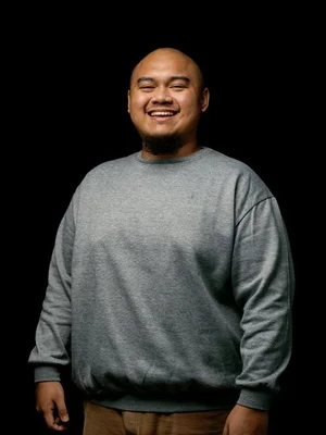 Picture of Ardhana smiling against a black screen