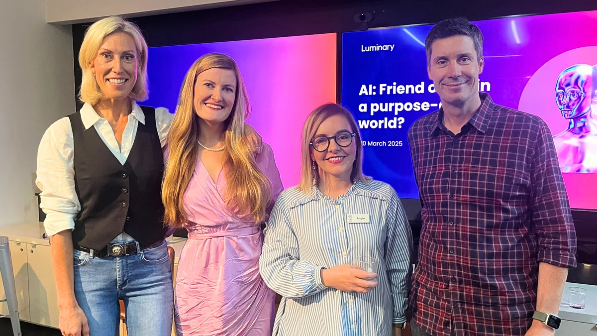 Picture of three female CEOs and one male CEO - in front of AI event screen