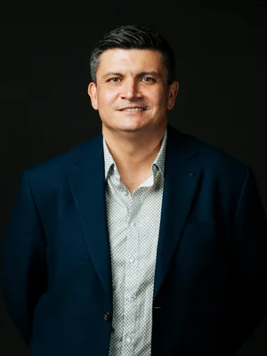 Picture of Jono P against a black background
