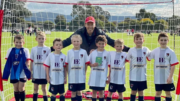 Coach Adam with his son's soccer team