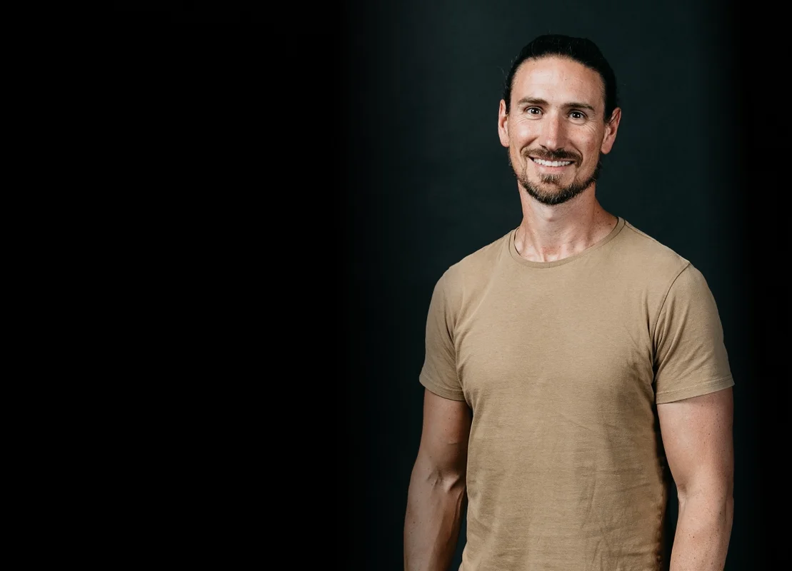 Picture of Luminary CTO Andy smiling with a black background