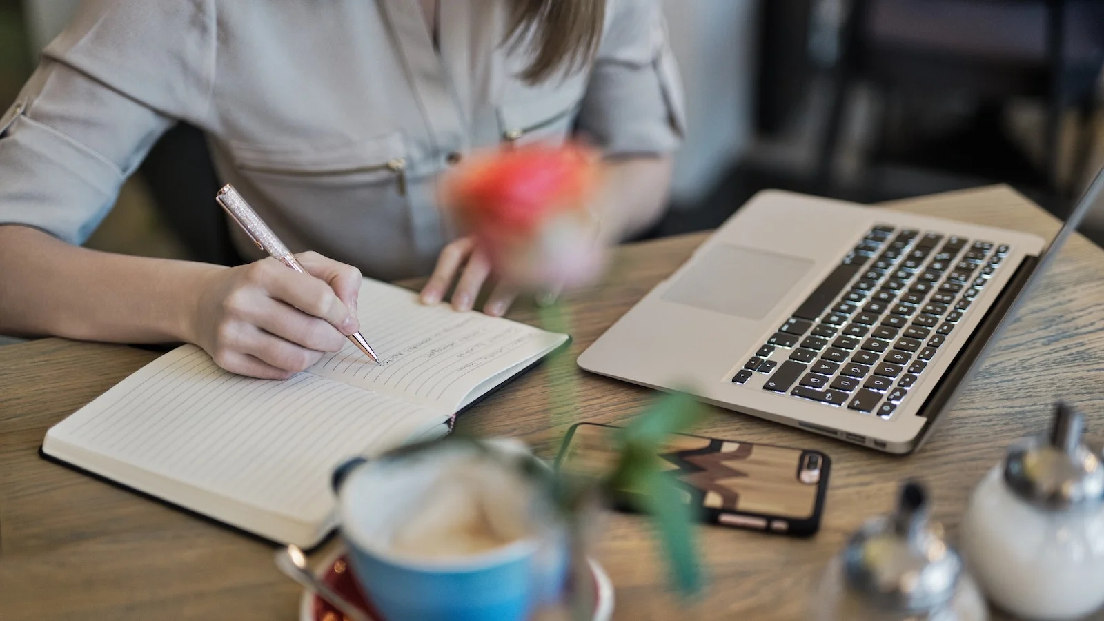 Woman with laptop and notebook