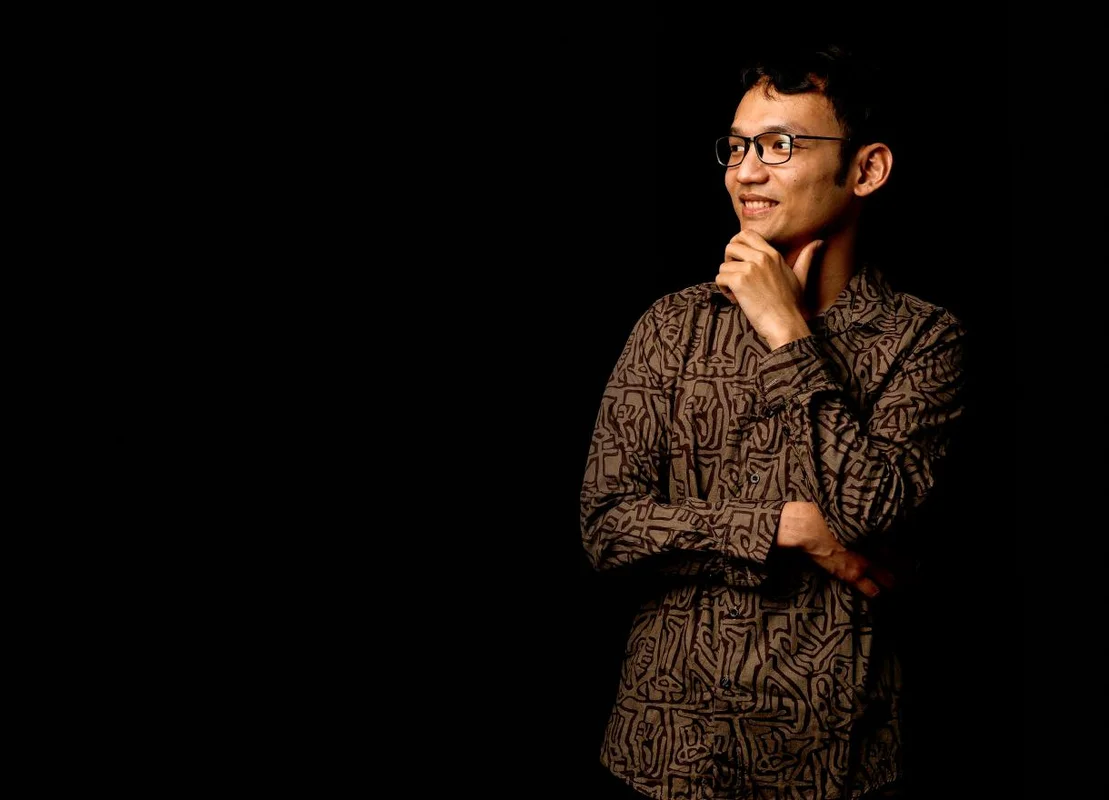 Picture of Rahman against a black screen