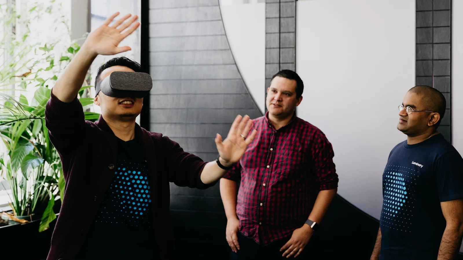 Luminary team members using VR