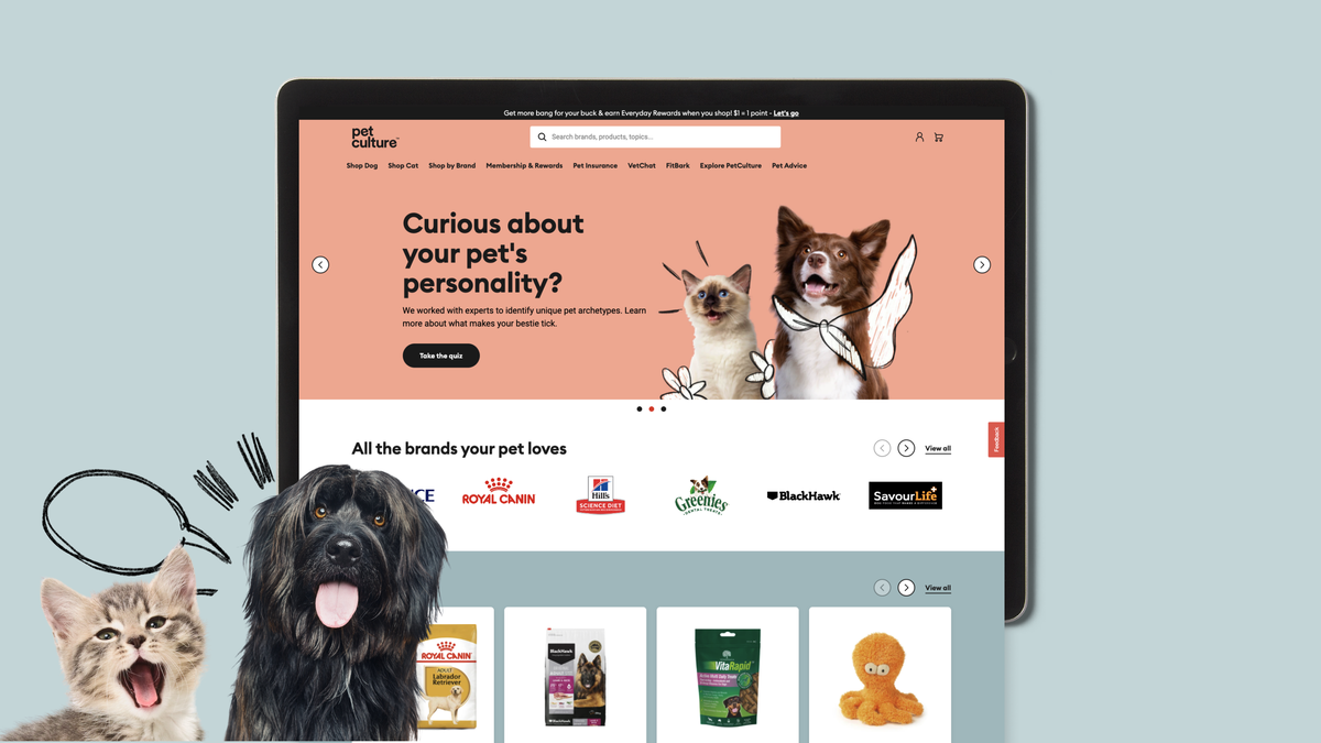 Pet Culture website on tablet with cat and dog in foreground