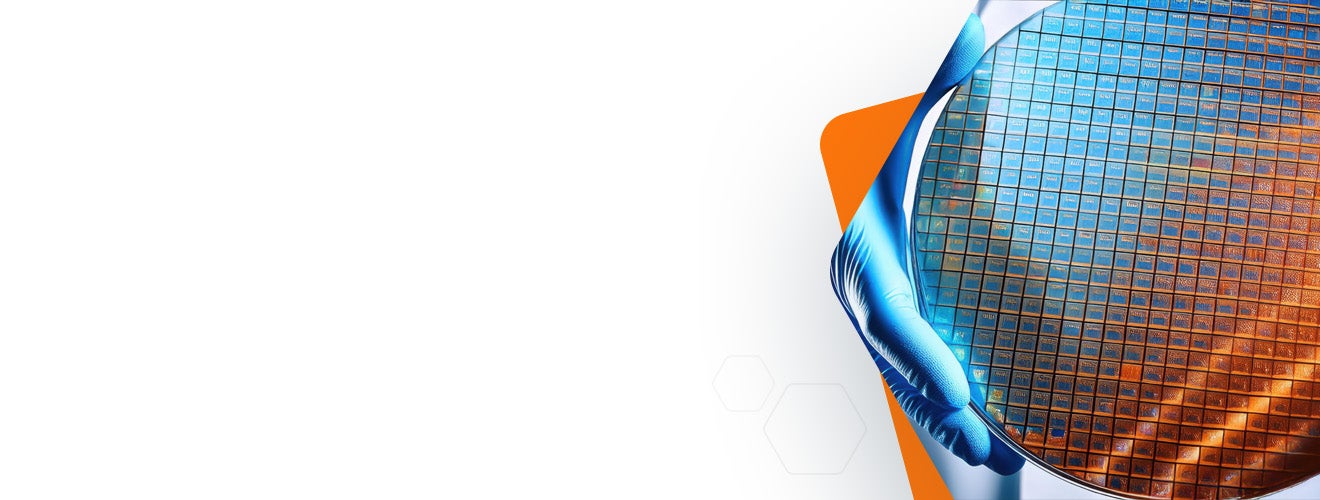 A person holding silicon wafer with chips