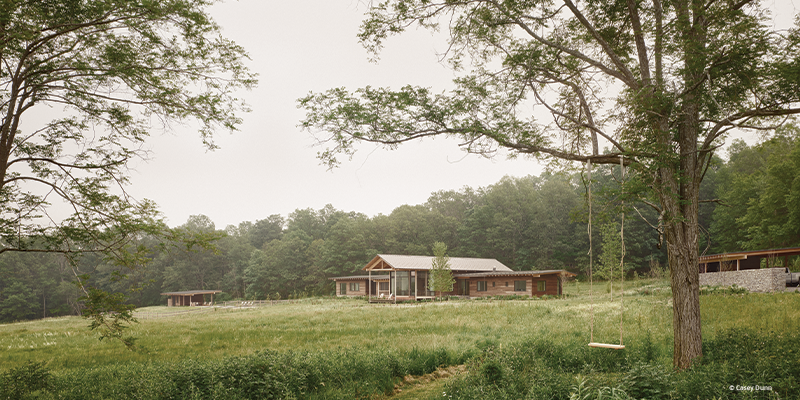 Two outbuildings are set apart from the main house: the carport and the pool house