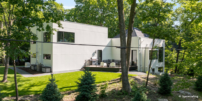 Side of home featuring forgent windows