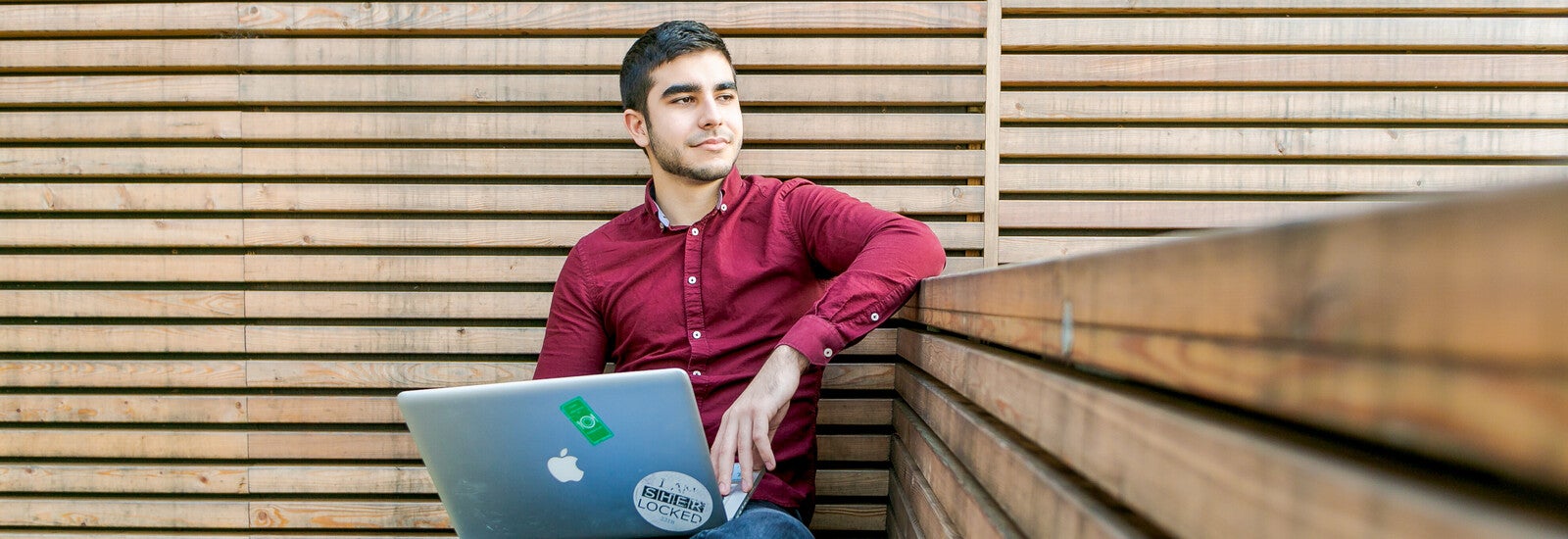 Two students looking at a piece of paper together