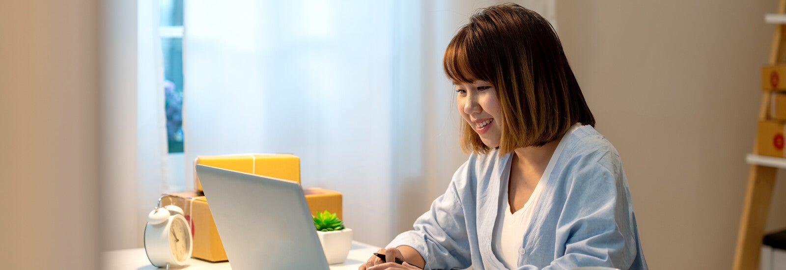 Student using laptop in accommodation