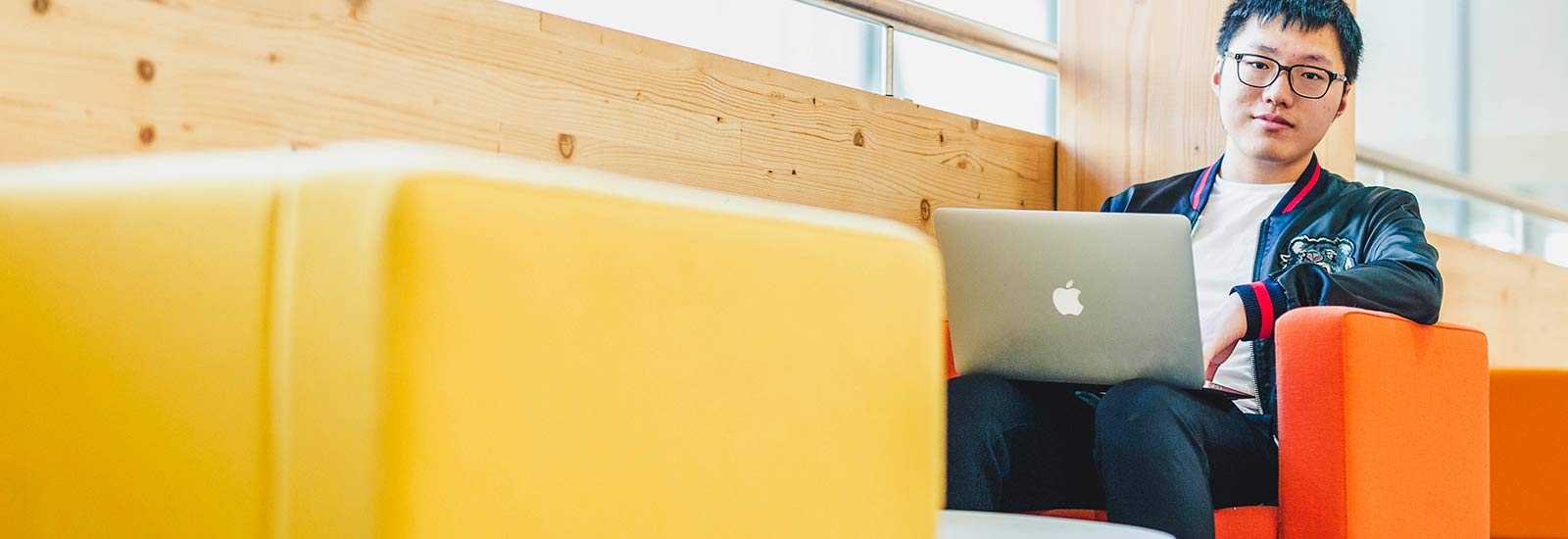 Student studying on laptop on campus