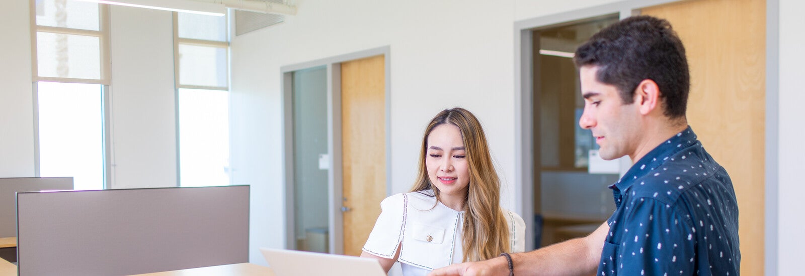 Two students working together in a classroom