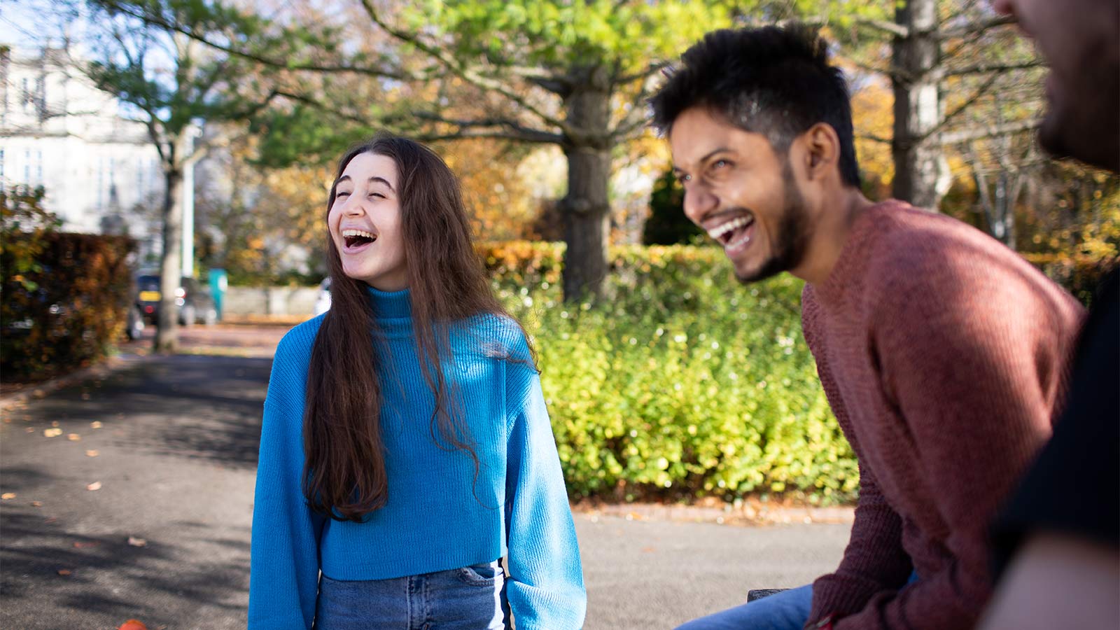 Cardiff University students laughing on campus
