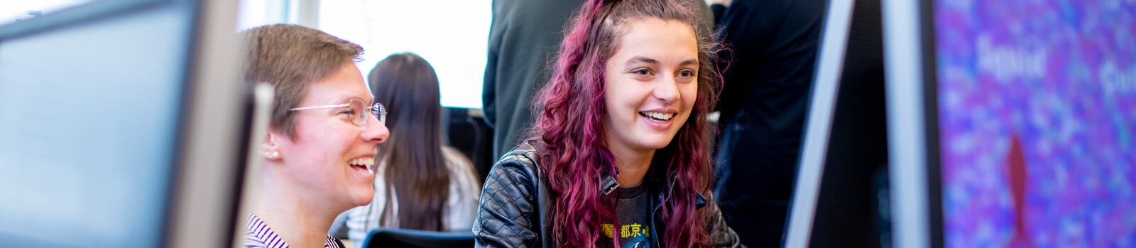 Student and tutor using computer