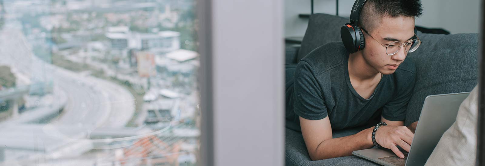 A student working remotely on a laptop at home