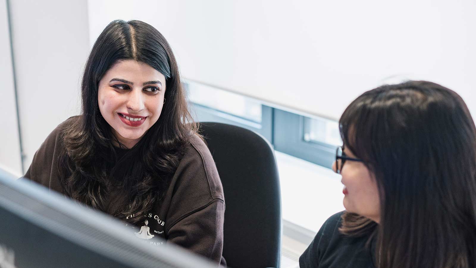 Two Huddersfield London students on a PC