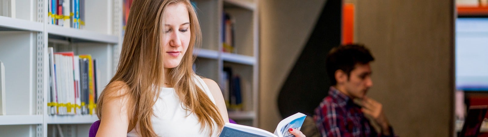 Student reading in the library