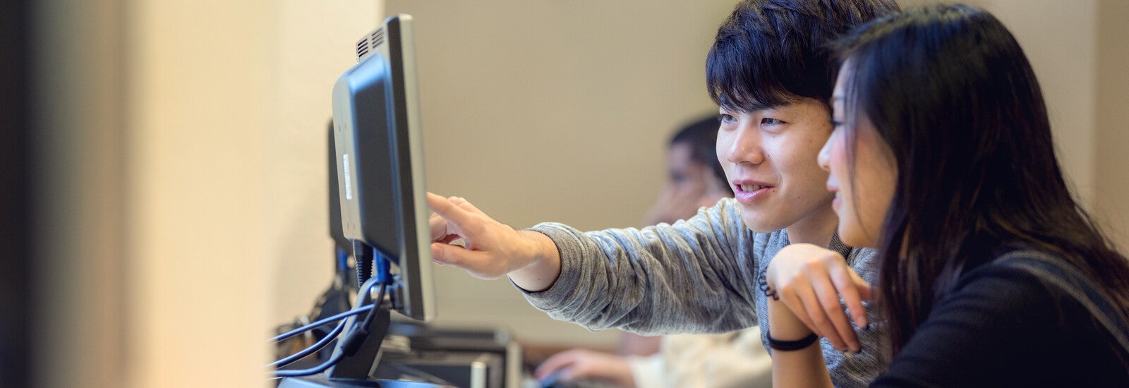 Employees sitting around a table chatting.