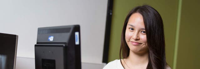 An international student smiling in Liverpool.