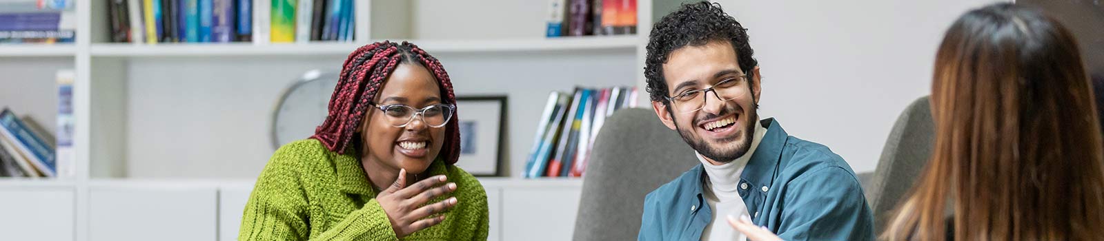 Surrey students talking on campus together