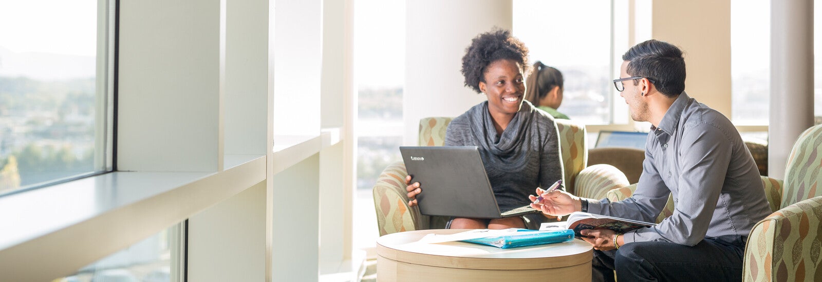 Two students studying together at a table