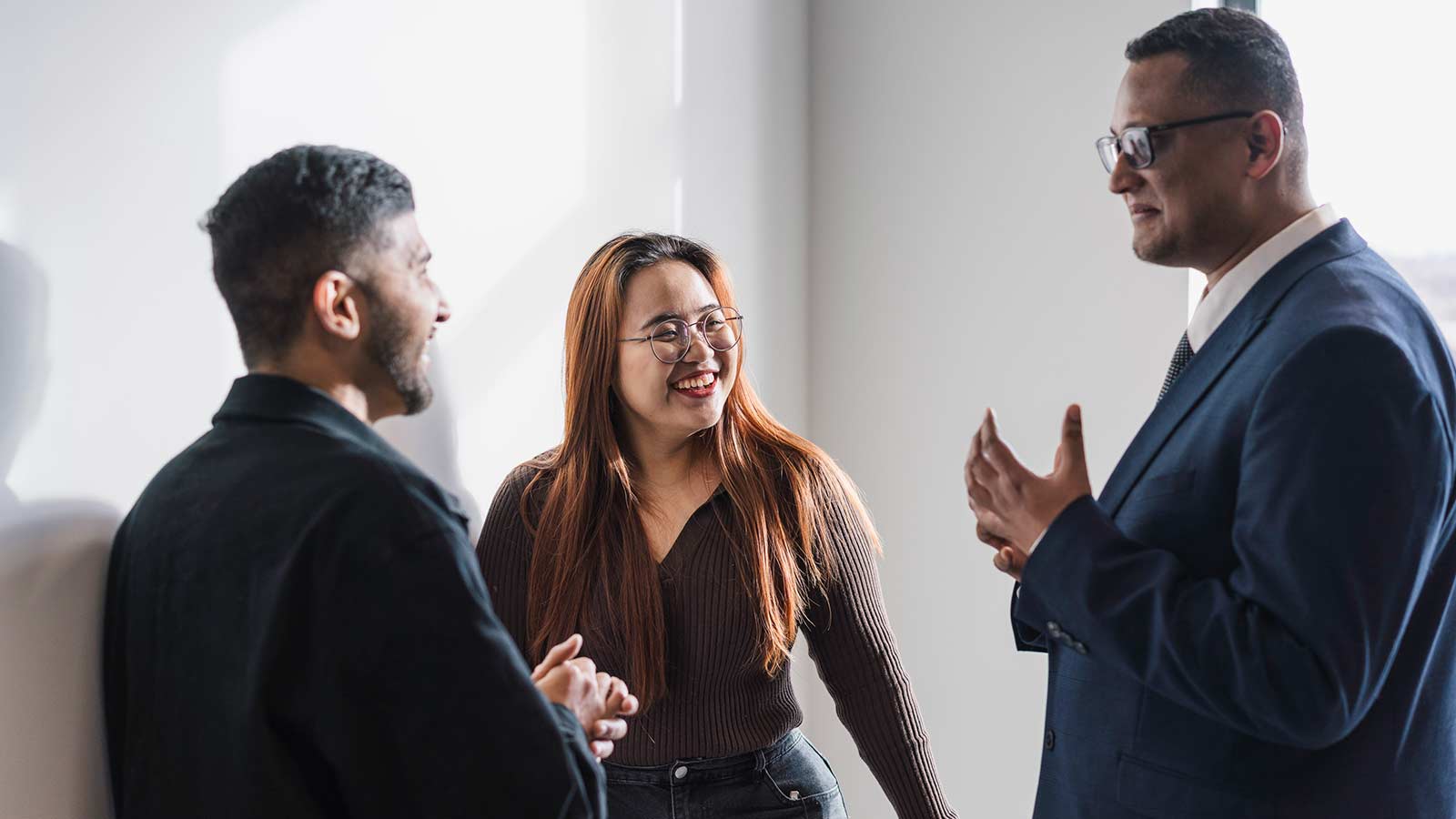 Students smiling and talking in campus