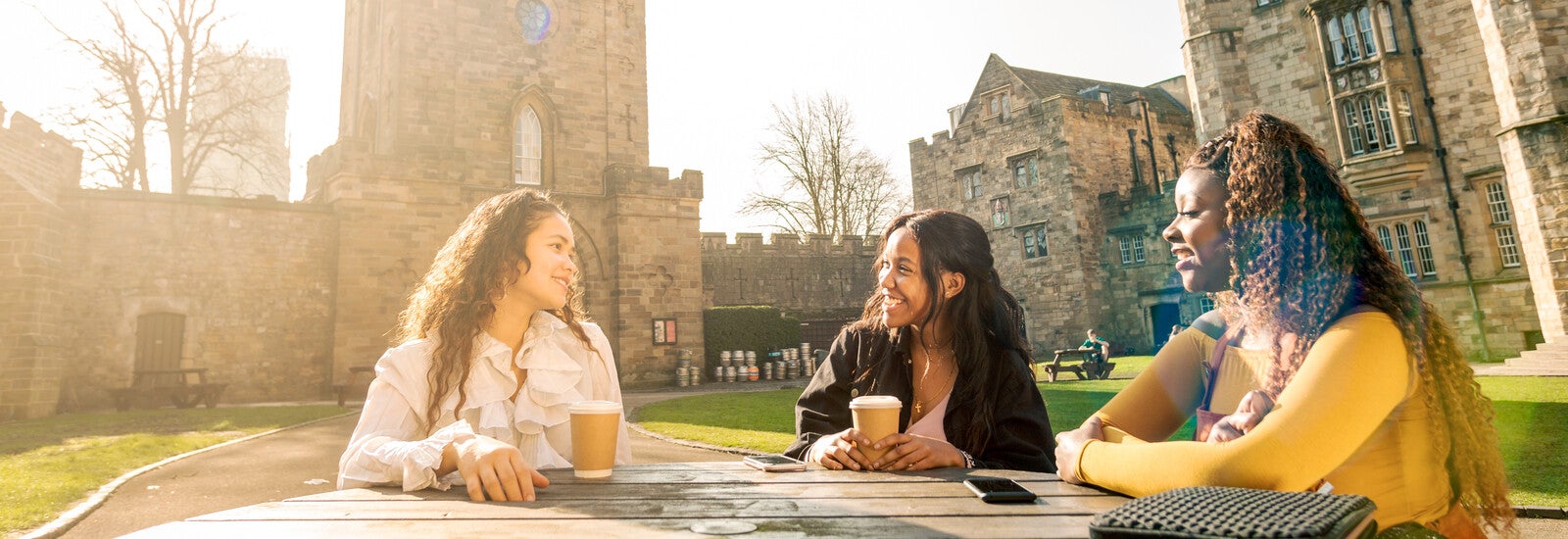 Students studying outside campus