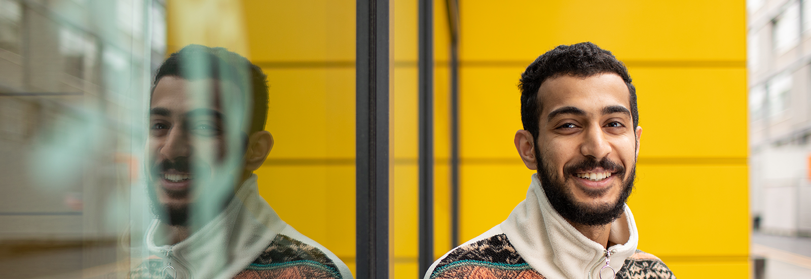 A student stood outside uni campus