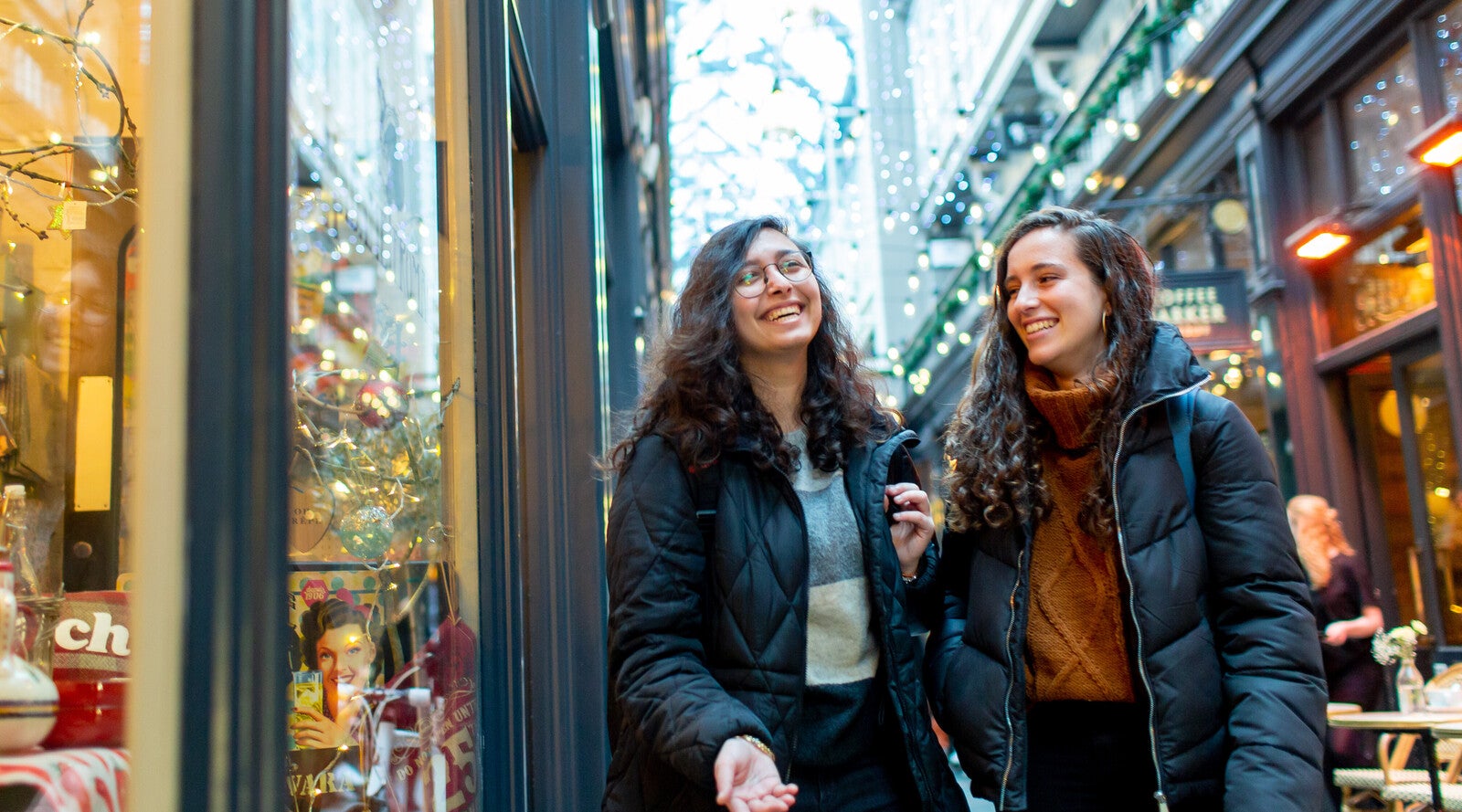 Students smiling and walking down high street