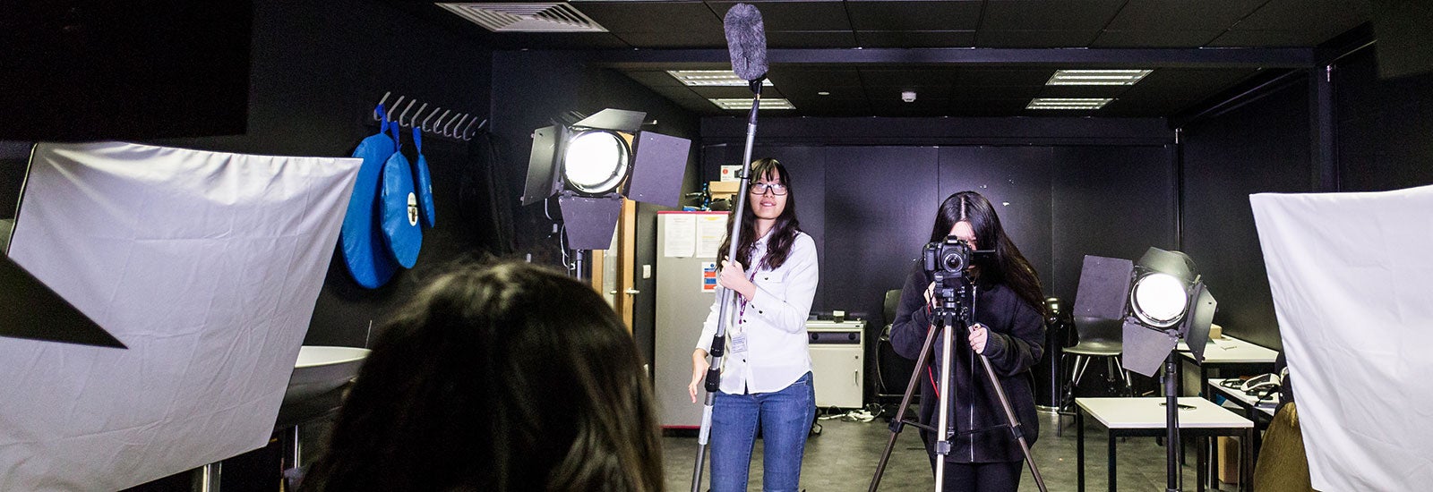 Media students filming content in a studio