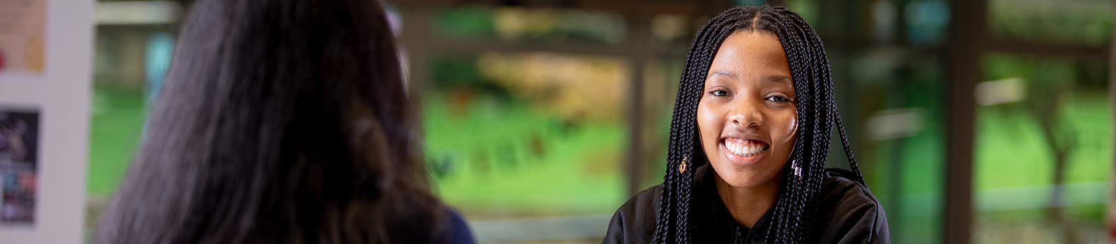 A University of Surrey ISC student talking to a friend