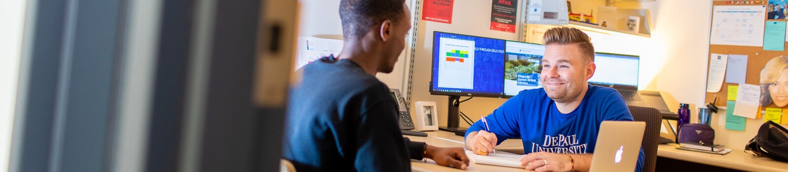 Student admissions assistant talking to student