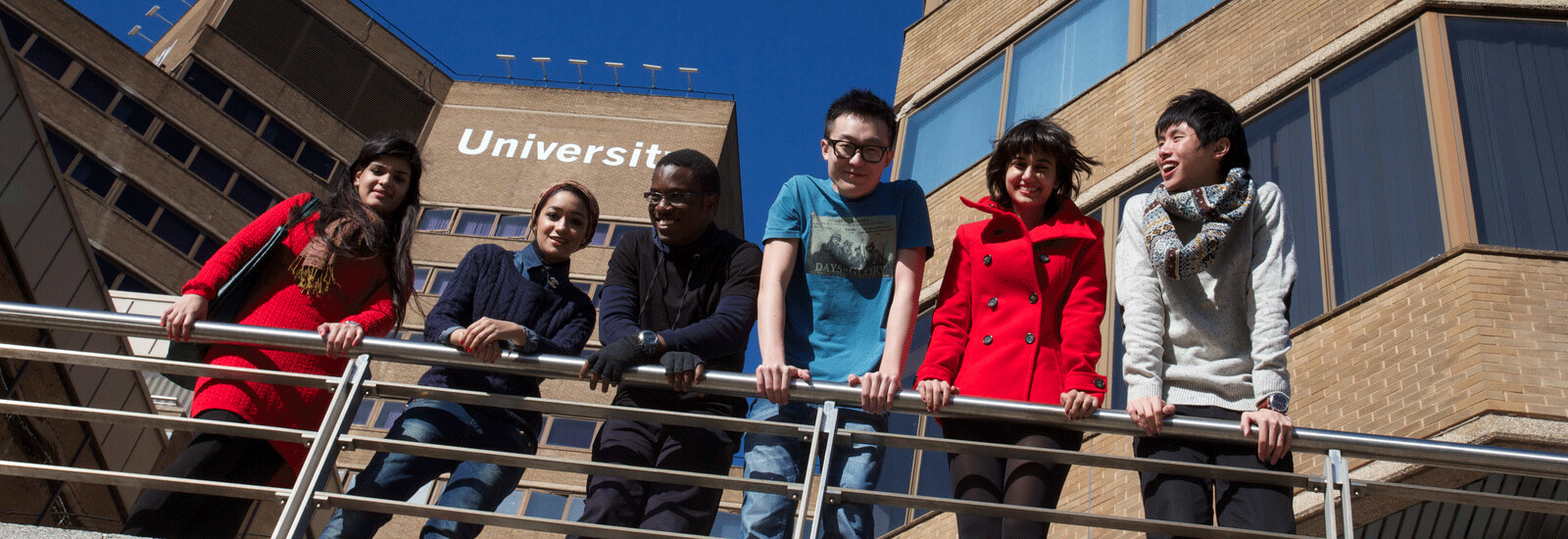 Students standing outside campus building
