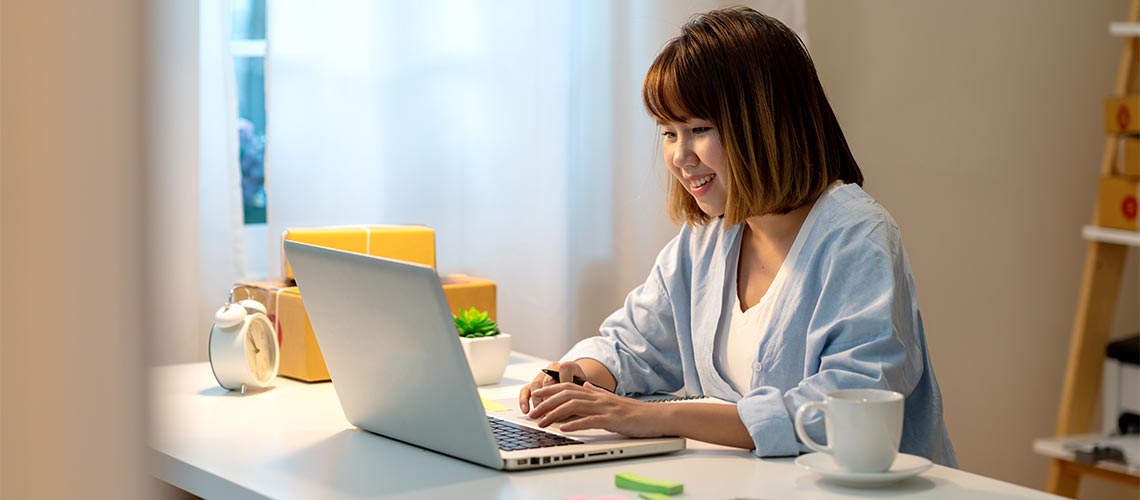 Strathclyde student working on laptop