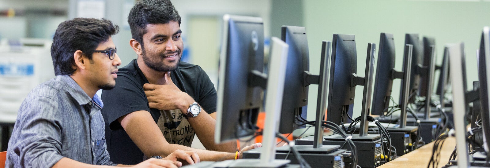 Students working on computer together